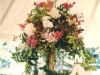 Birch pole topiaries lush with cascading flora and English ivy for the tall tables