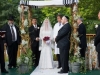Earthy and simple free standing birch pole chuppah with ropings of gypsophilia and herbs