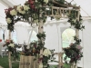 Rustic and natural arbor of birch, wisteria and manzanita to sit under