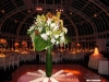 Escort table with large fauna, agapanthus, assorted roses, cymbidium orchids and more.